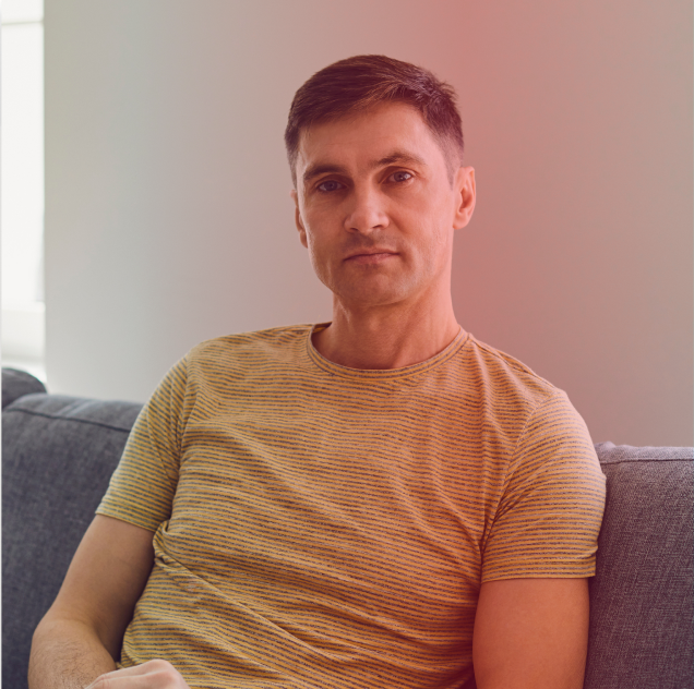 Man sitting on couch - mobile
